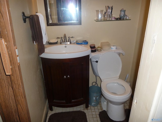 bathroom featuring toilet and vanity
