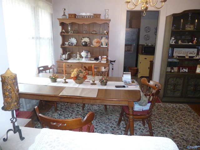 dining room featuring a notable chandelier