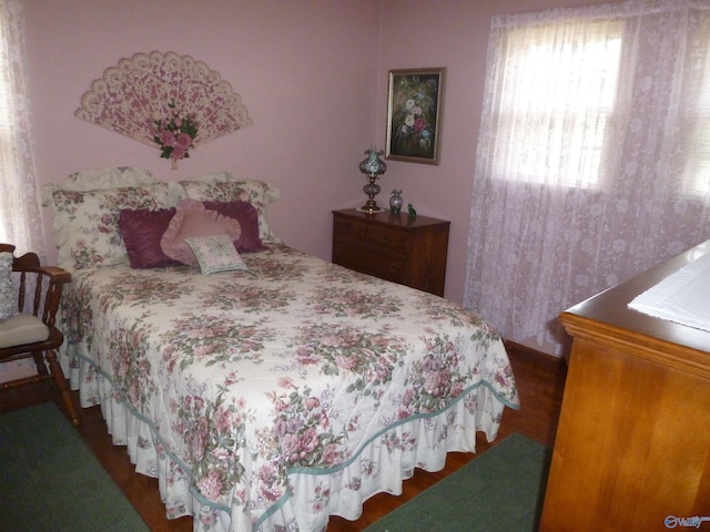 bedroom featuring wood finished floors