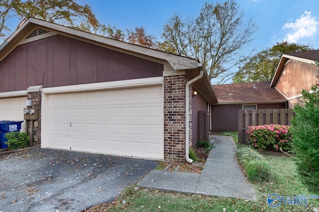 view of property exterior with a garage