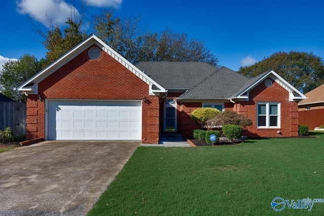 view of front of home featuring a front lawn and a garage