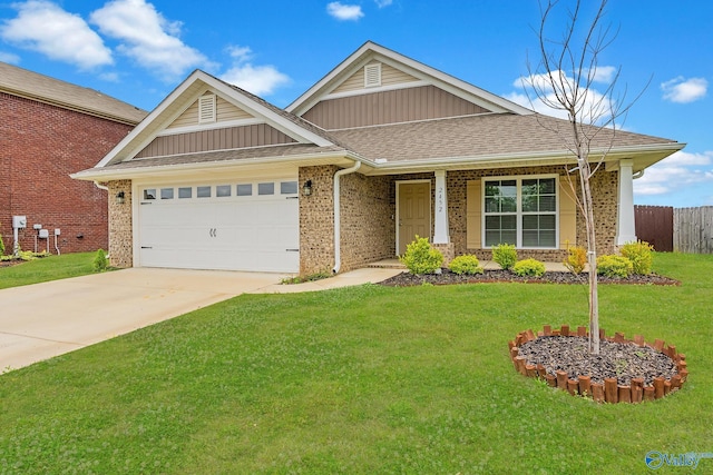 2452 Belltown Dr, Huntsville, AL 35803 - view of front of house featuring a garage, brick siding, driveway, and board and batten siding