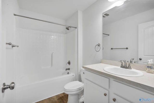 2452 Belltown Dr, Huntsville, AL 35803 - full bathroom featuring wood finished floors, toilet, vanity, and  shower combination