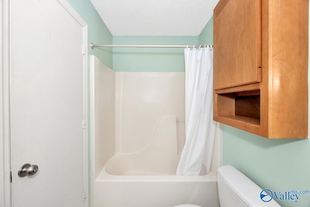 249 Knox Creek Trl NW, Madison, AL 35757 - bathroom featuring shower / bath combo with shower curtain and a textured ceiling