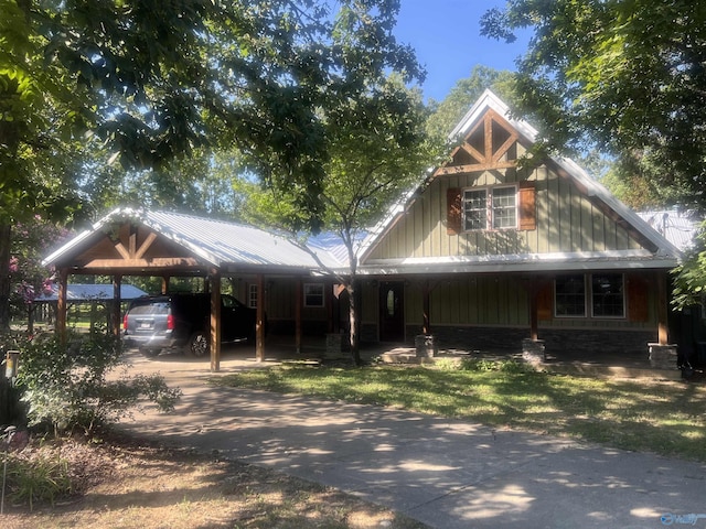 view of front of property with a carport and driveway