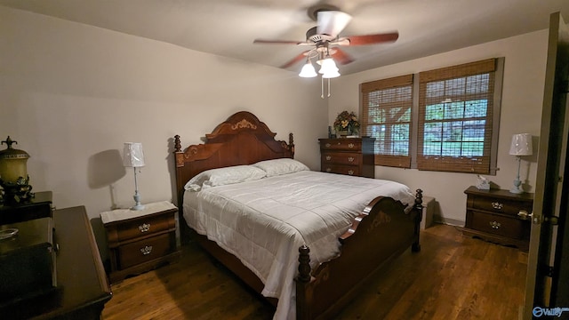 bedroom featuring ceiling fan and dark hardwood / wood-style floors