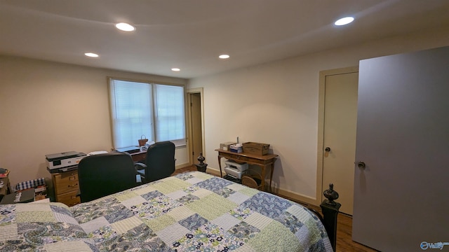 bedroom with wood-type flooring