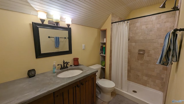 full bathroom with lofted ceiling, tiled shower, vanity, and toilet