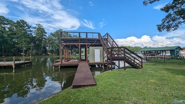 dock area with a water view and a yard