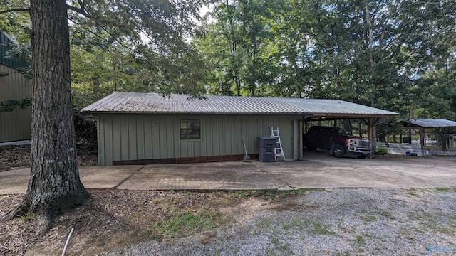 view of outdoor structure with an attached carport