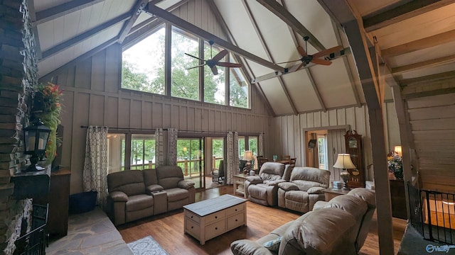 living room featuring beam ceiling, ceiling fan, high vaulted ceiling, and hardwood / wood-style flooring