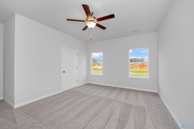 carpeted empty room with ceiling fan