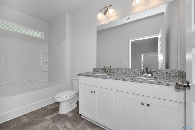 full bathroom featuring vanity, washtub / shower combination, and toilet