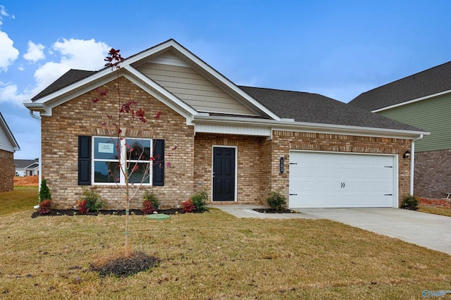 view of front of home with a garage and a front yard