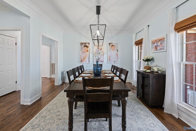 dining room with dark wood-type flooring and ornamental molding