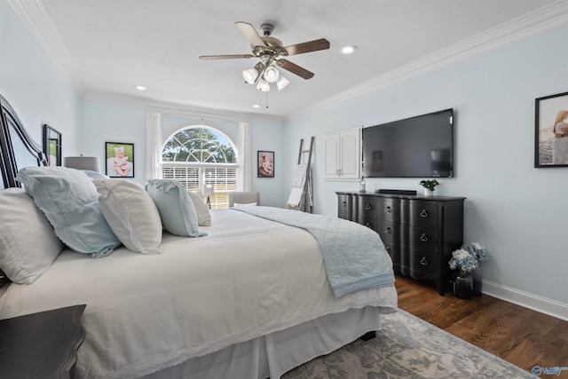 bedroom with crown molding, dark hardwood / wood-style floors, and ceiling fan