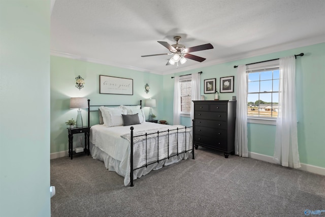 bedroom with crown molding, carpet floors, and ceiling fan