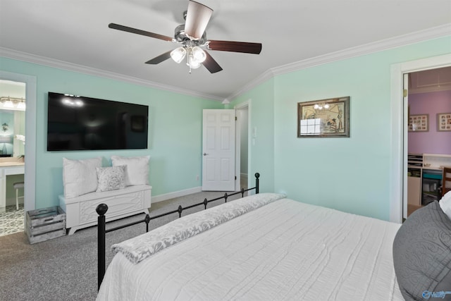 bedroom with crown molding, connected bathroom, carpet, and ceiling fan