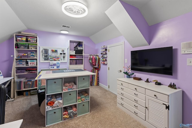 playroom featuring lofted ceiling and light colored carpet