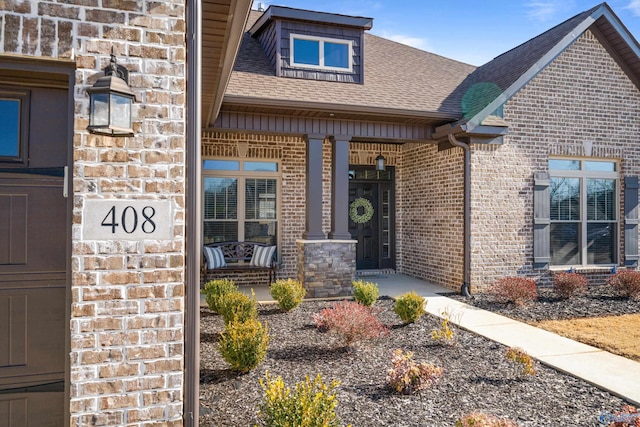 entrance to property featuring a porch