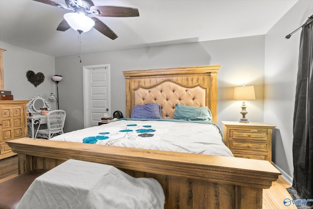 bedroom featuring ceiling fan and hardwood / wood-style flooring