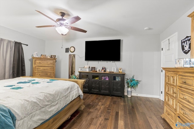 bedroom with ceiling fan and dark hardwood / wood-style floors