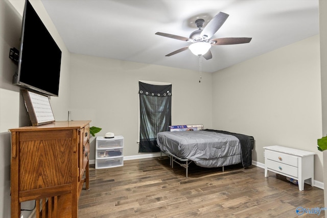 bedroom with ceiling fan and wood-type flooring