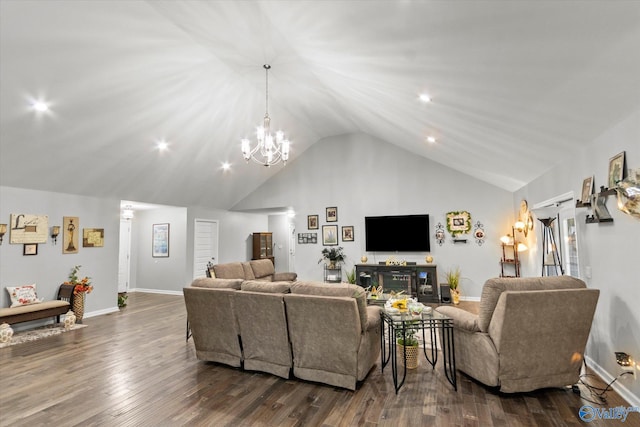 living room with dark hardwood / wood-style floors, a notable chandelier, and lofted ceiling