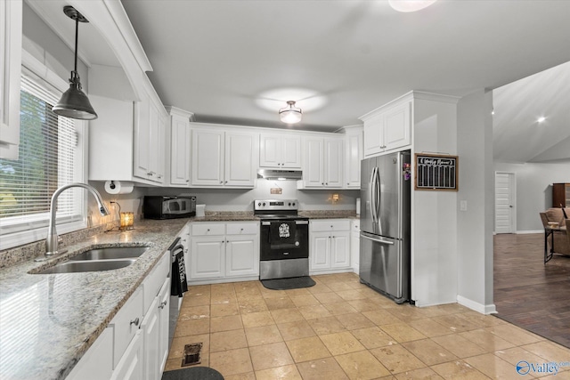 kitchen featuring sink, light stone countertops, light hardwood / wood-style floors, stainless steel appliances, and white cabinets