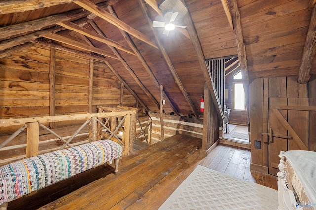 unfinished attic with an upstairs landing