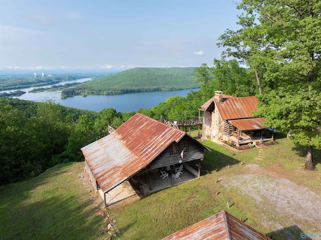 bird's eye view featuring a water view and a wooded view