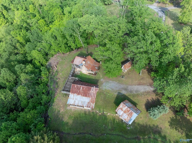 birds eye view of property with a wooded view