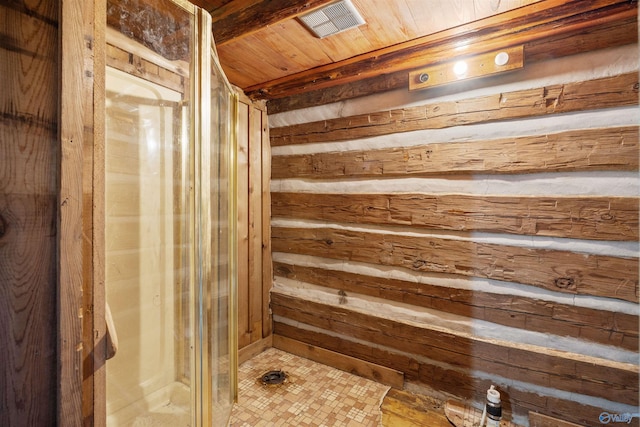 bathroom featuring wooden walls, a sauna, a shower stall, and wooden ceiling