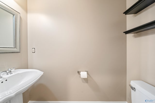 bathroom featuring a sink and toilet