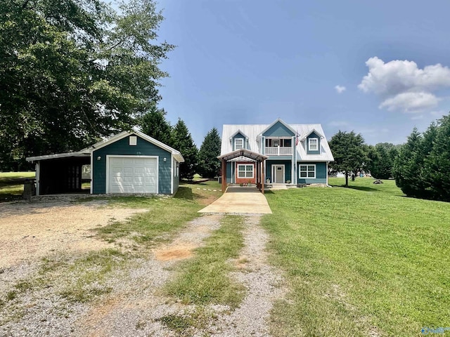 415 County Road 355, Leesburg, AL 35983 - view of front of home featuring a balcony, dirt driveway, a front yard, a detached garage, and an outdoor structure