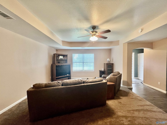 415 County Road 355, Leesburg, AL 35983 - living room with arched walkways, a ceiling fan, and a textured ceiling