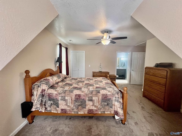 415 County Road 355, Leesburg, AL 35983 - carpeted bedroom featuring a textured ceiling, a ceiling fan, a closet, and ensuite bathroom