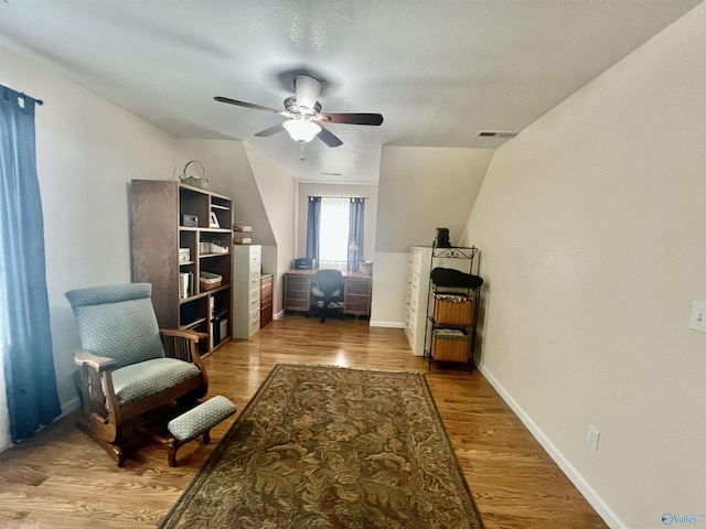 415 County Road 355, Leesburg, AL 35983 - sitting room with ceiling fan, wood finished floors, vaulted ceiling, and a textured ceiling