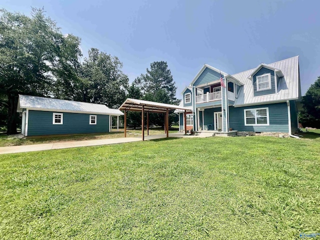 415 County Road 355, Leesburg, AL 35983 - view of front of property with a balcony, a metal roof, a front yard, and a carport