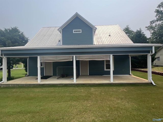 415 County Road 355, Leesburg, AL 35983 - back of house featuring a metal roof, a lawn, and covered porch