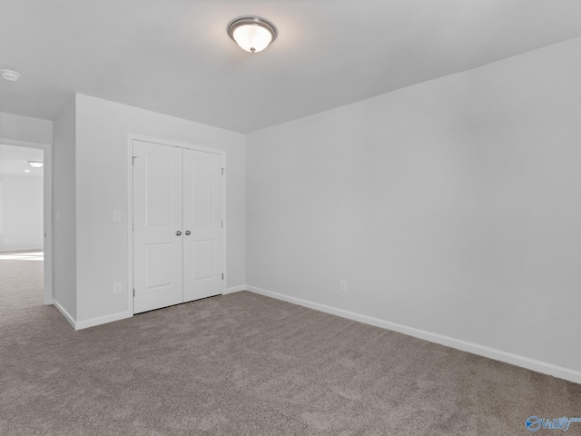 unfurnished bedroom featuring a closet and carpet