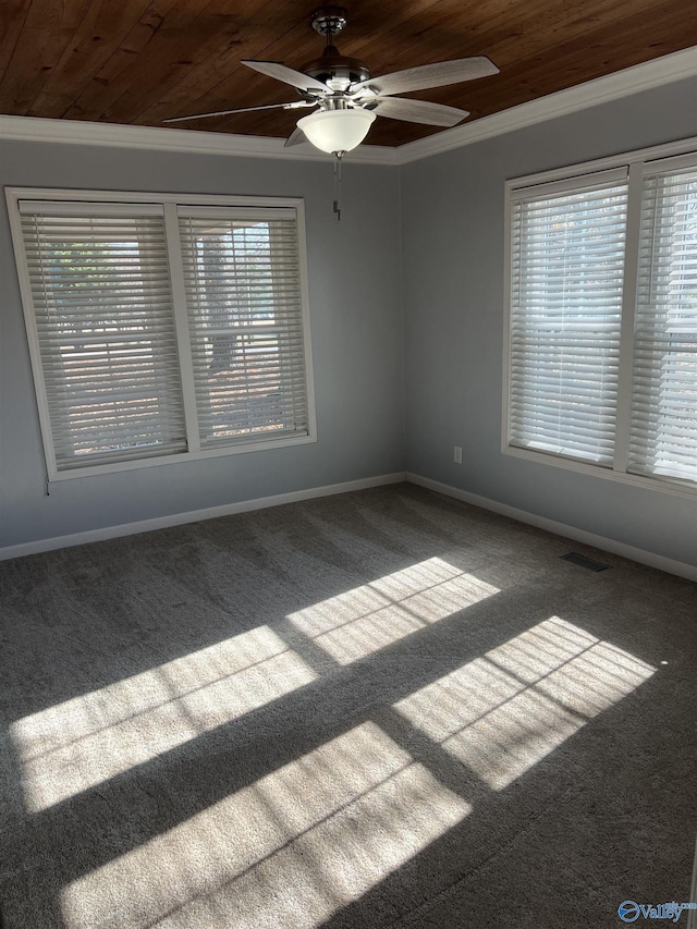 carpeted empty room with ceiling fan, wood ceiling, and ornamental molding