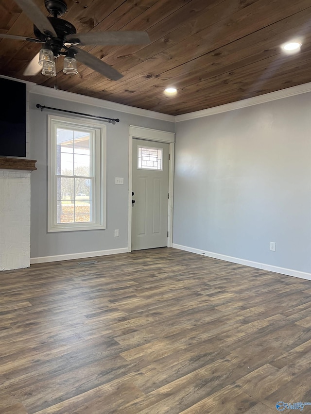 entryway with ornamental molding, dark hardwood / wood-style floors, ceiling fan, and wooden ceiling