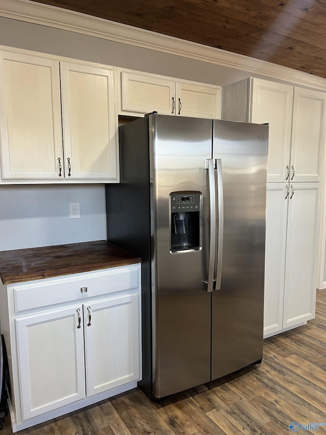 kitchen featuring stainless steel fridge, ornamental molding, wood ceiling, white cabinets, and dark hardwood / wood-style floors