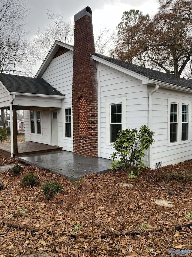 back of house with a patio