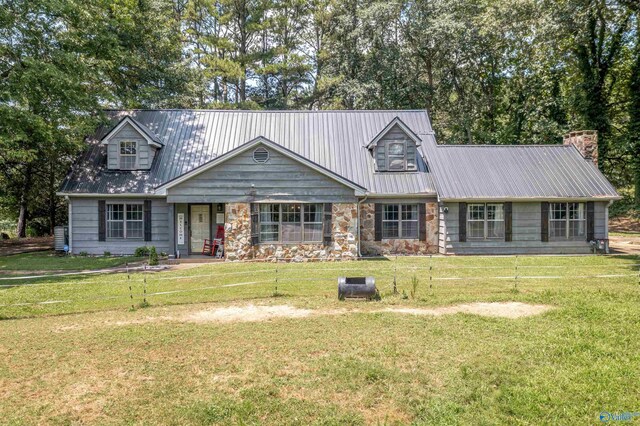 new england style home with a front yard