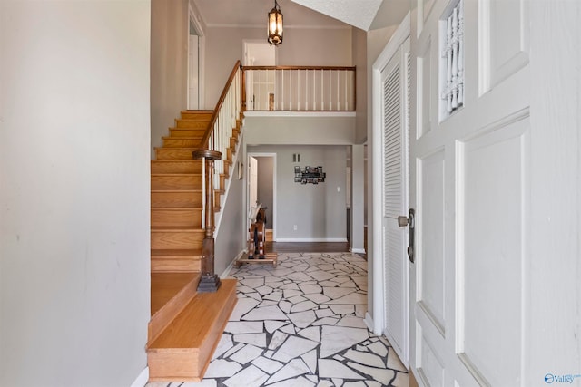 entryway featuring a towering ceiling