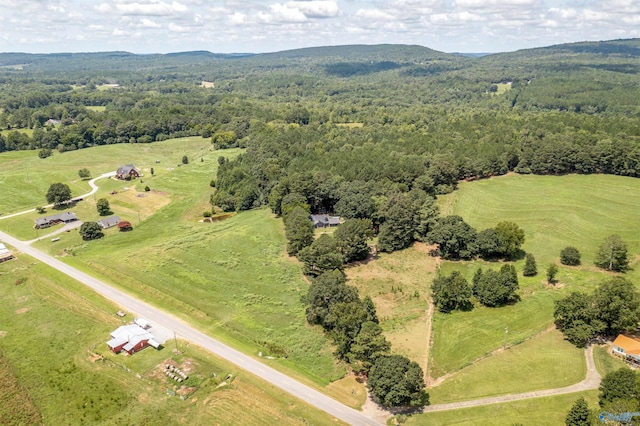 bird's eye view with a forest view and a rural view