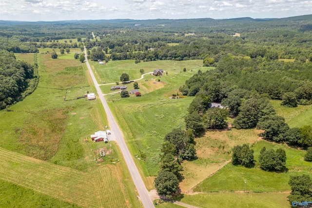 birds eye view of property with a rural view