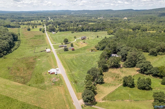 bird's eye view featuring a forest view and a rural view